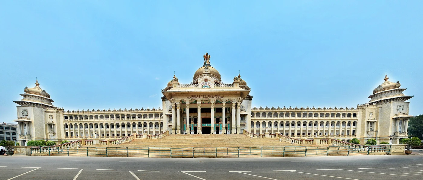 Vidhana Soudha landmark in Bengaluru beneath a blue sky